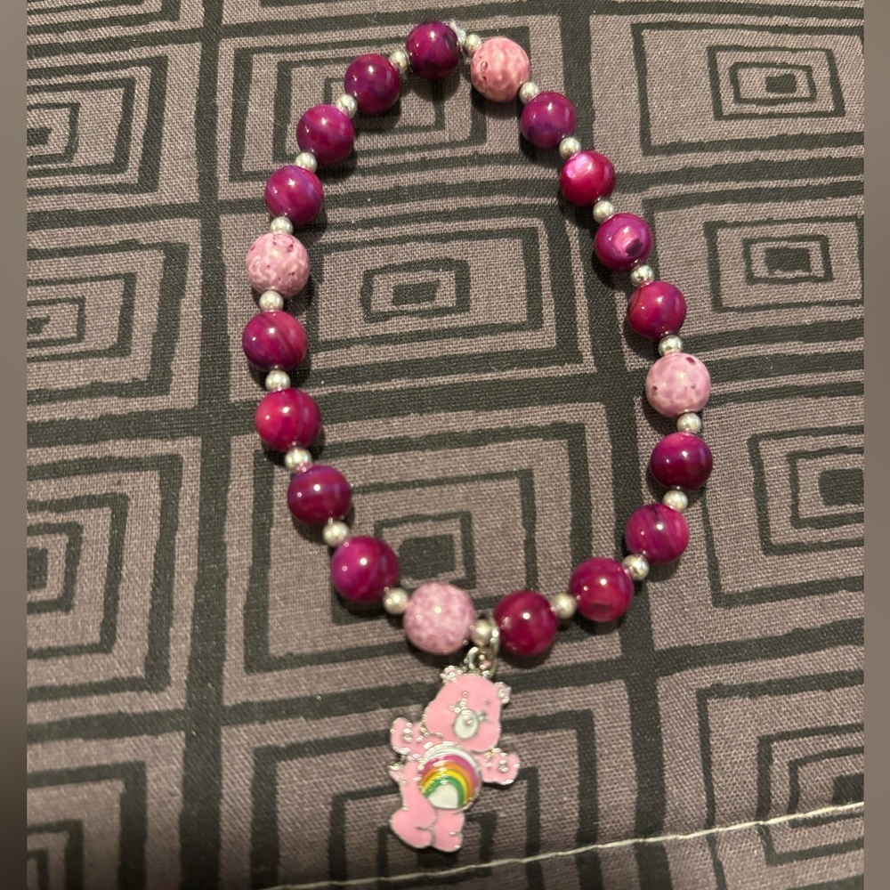 Elastic beaded bracelet with care bear charm